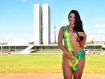 Mulher de novo ministro do Turismo causa polêmica ao tirar a roupa em protesto